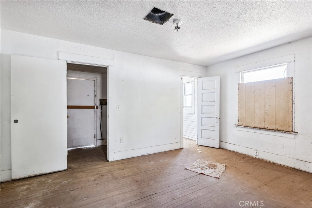 518 A Street Needles, CA 92363 - Photo 16 of 49 an empty room with windows and closet