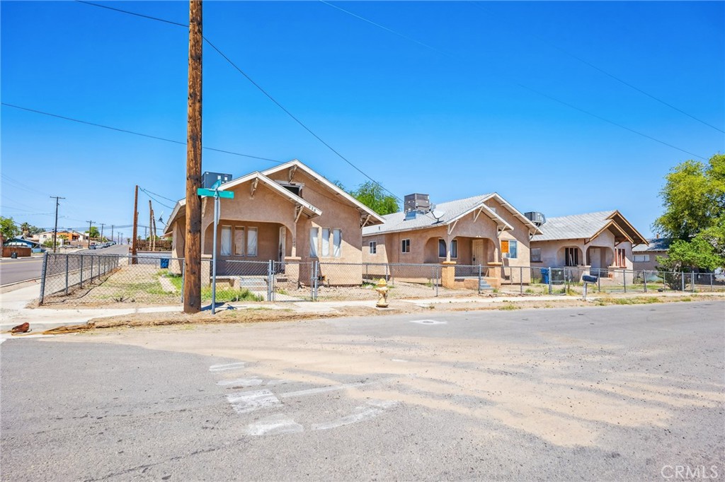 518 A Street Needles, CA 92363 - Photo 2 of 49 a front view of a house with a yard