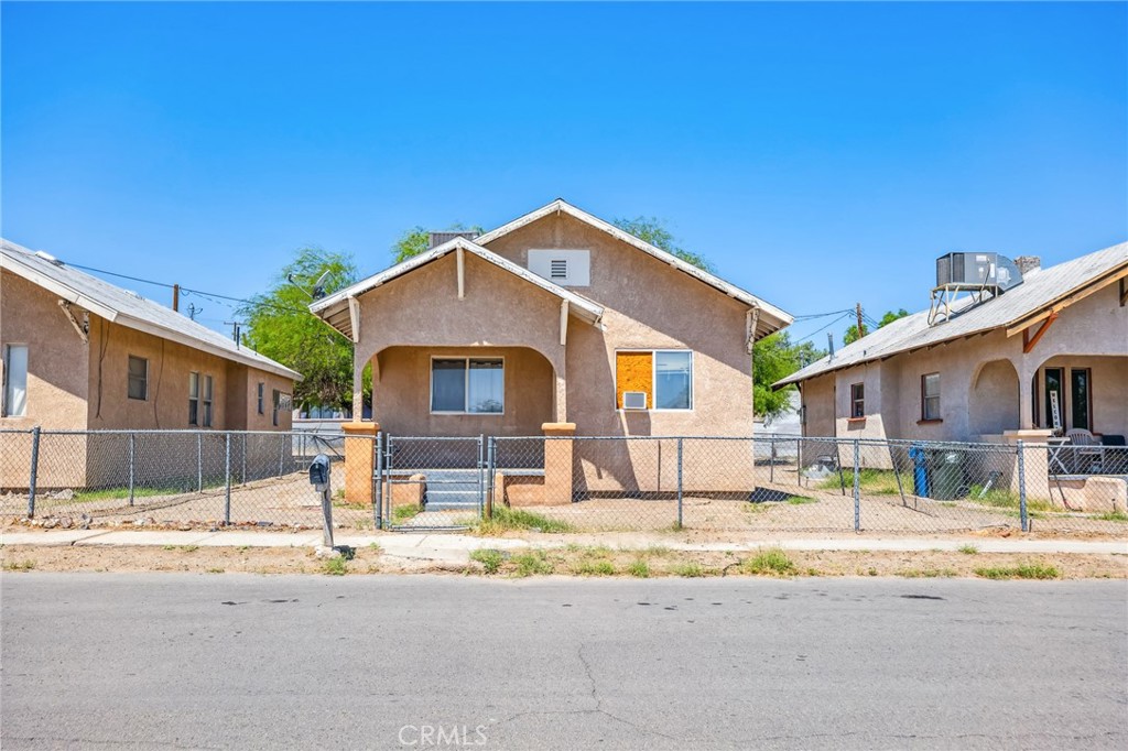 518 A Street Needles, CA 92363 - Photo 21 of 49 a front view of a house with a yard