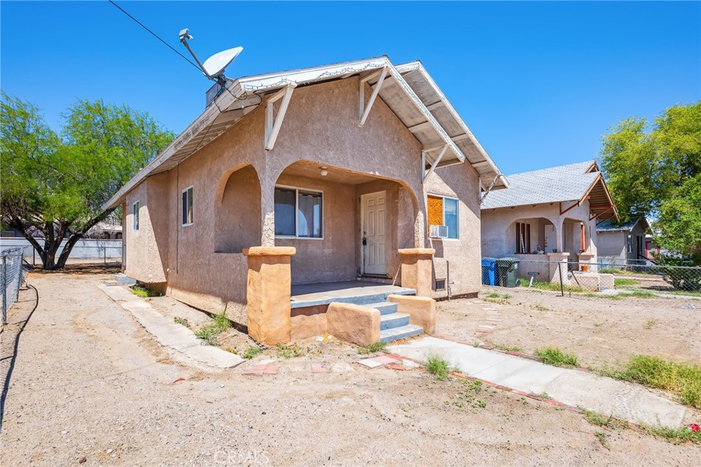 518 A Street Needles, CA 92363 - Photo 22 of 49 a front view of a house with a yard