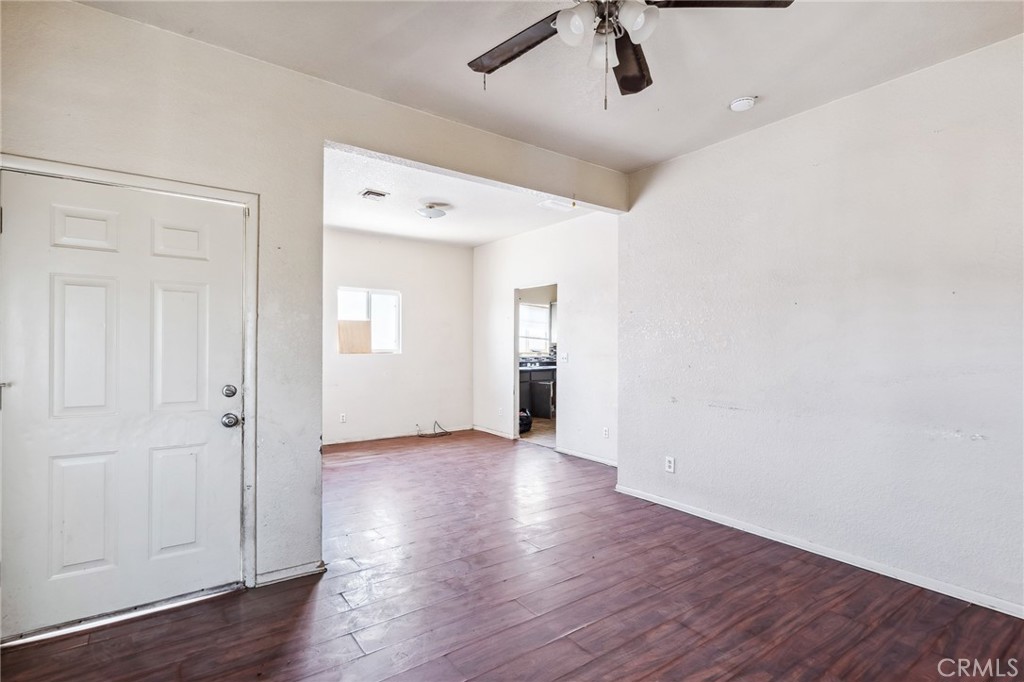 518 A Street Needles, CA 92363 - Photo 26 of 49 an empty room with wooden floor cabinet and windows