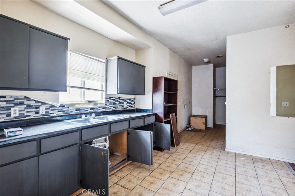 518 A Street Needles, CA 92363 - Photo 29 of 49 a kitchen with stainless steel appliances granite countertop a stove and a sink
