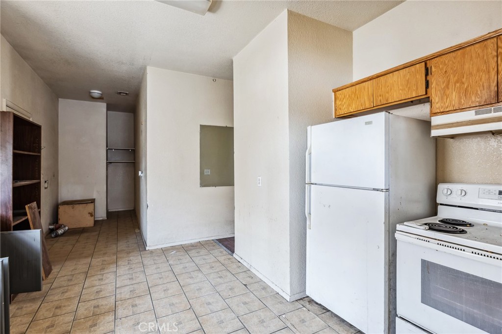 518 A Street Needles, CA 92363 - Photo 30 of 49 a white refrigerator freezer and a stove in a kitchen