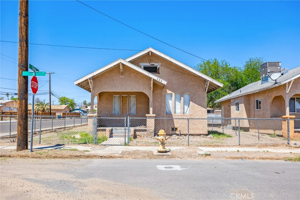 518 A Street Needles, CA 92363 - Photo 4 of 49 a front view of a house with a yard