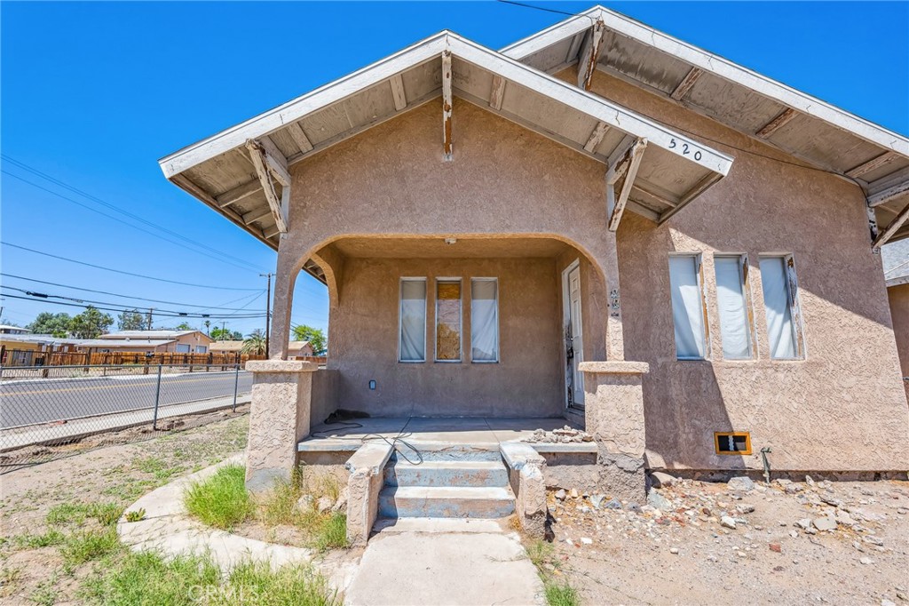 518 A Street Needles, CA 92363 - Photo 5 of 49 a front view of a house with a yard