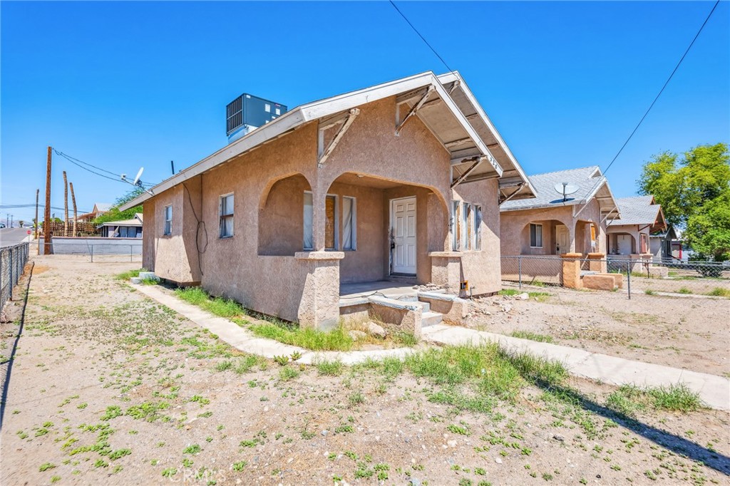 518 A Street Needles, CA 92363 - Photo 6 of 49 a front view of a house with a yard