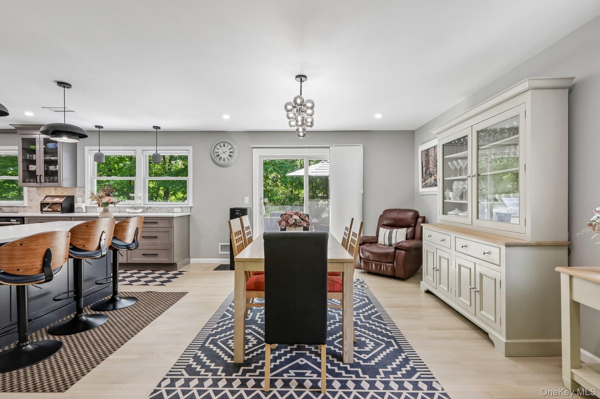 62 Mohegan Road Larchmont, NY 10538 - Photo 18 of 46 a living room with furniture two windows and wooden floor
