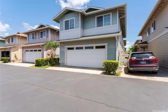a car parked in front of a brick house