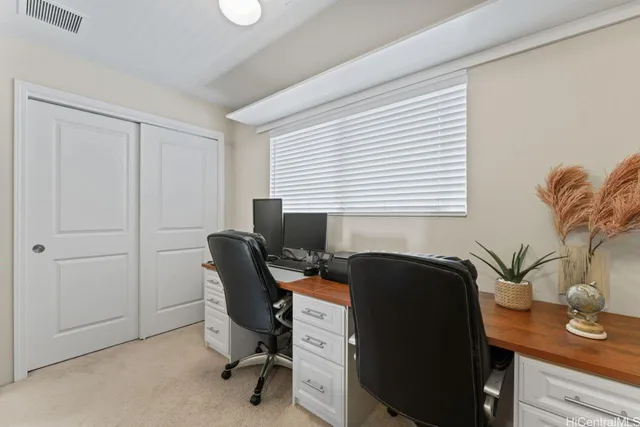 a bathroom with a sink double vanity granite toilet and a mirror