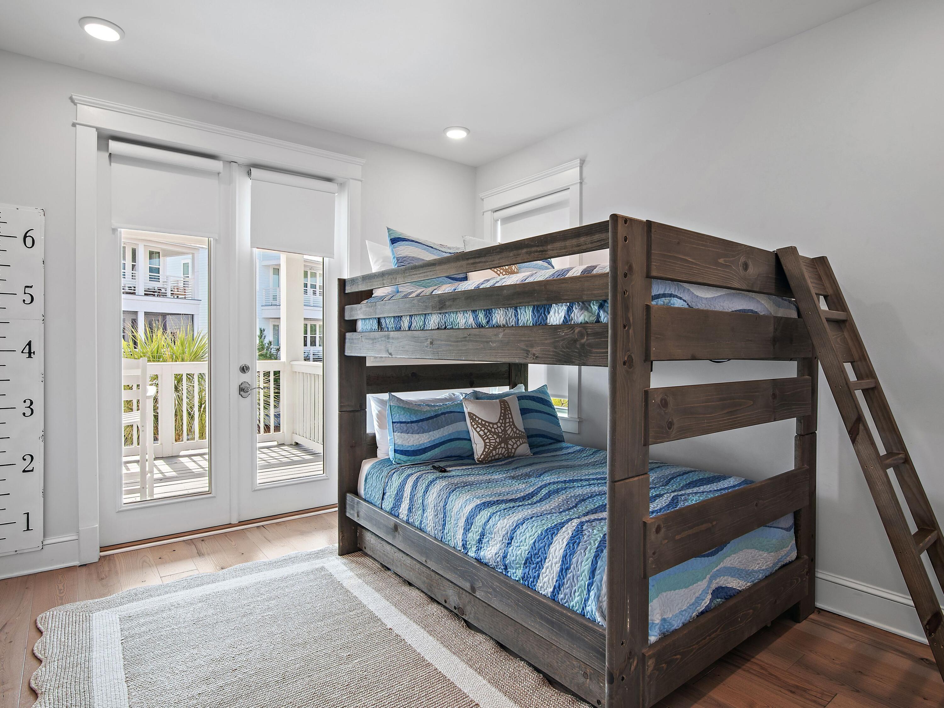 93 East Crabbing Hole Ln Inlet Beach Inlet Beach, FL 32461 - Photo 28 of 49 a bedroom with a large bed and a window