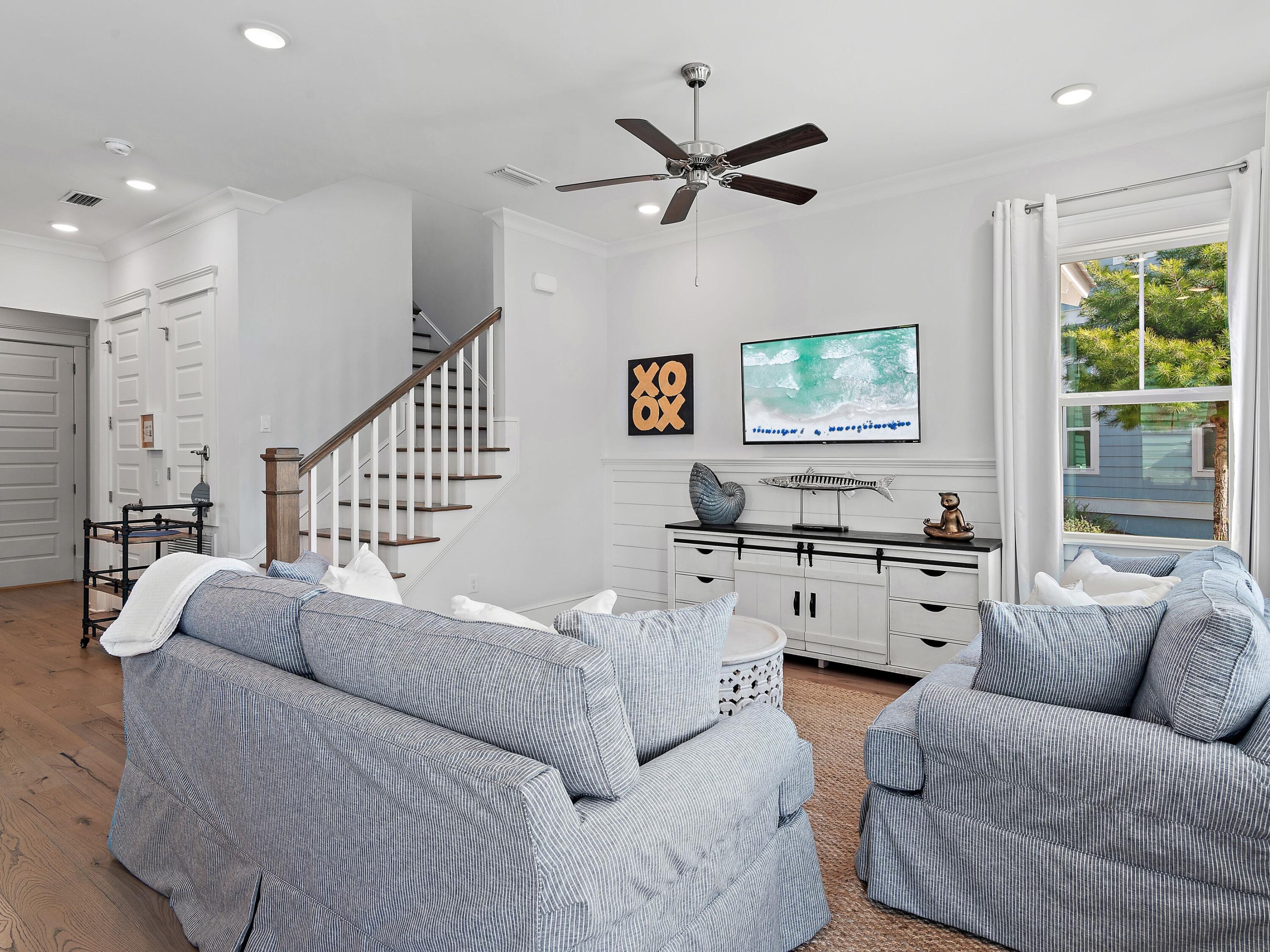 93 East Crabbing Hole Ln Inlet Beach Inlet Beach, FL 32461 - Photo 3 of 49 a living room with furniture kitchen view and a large window