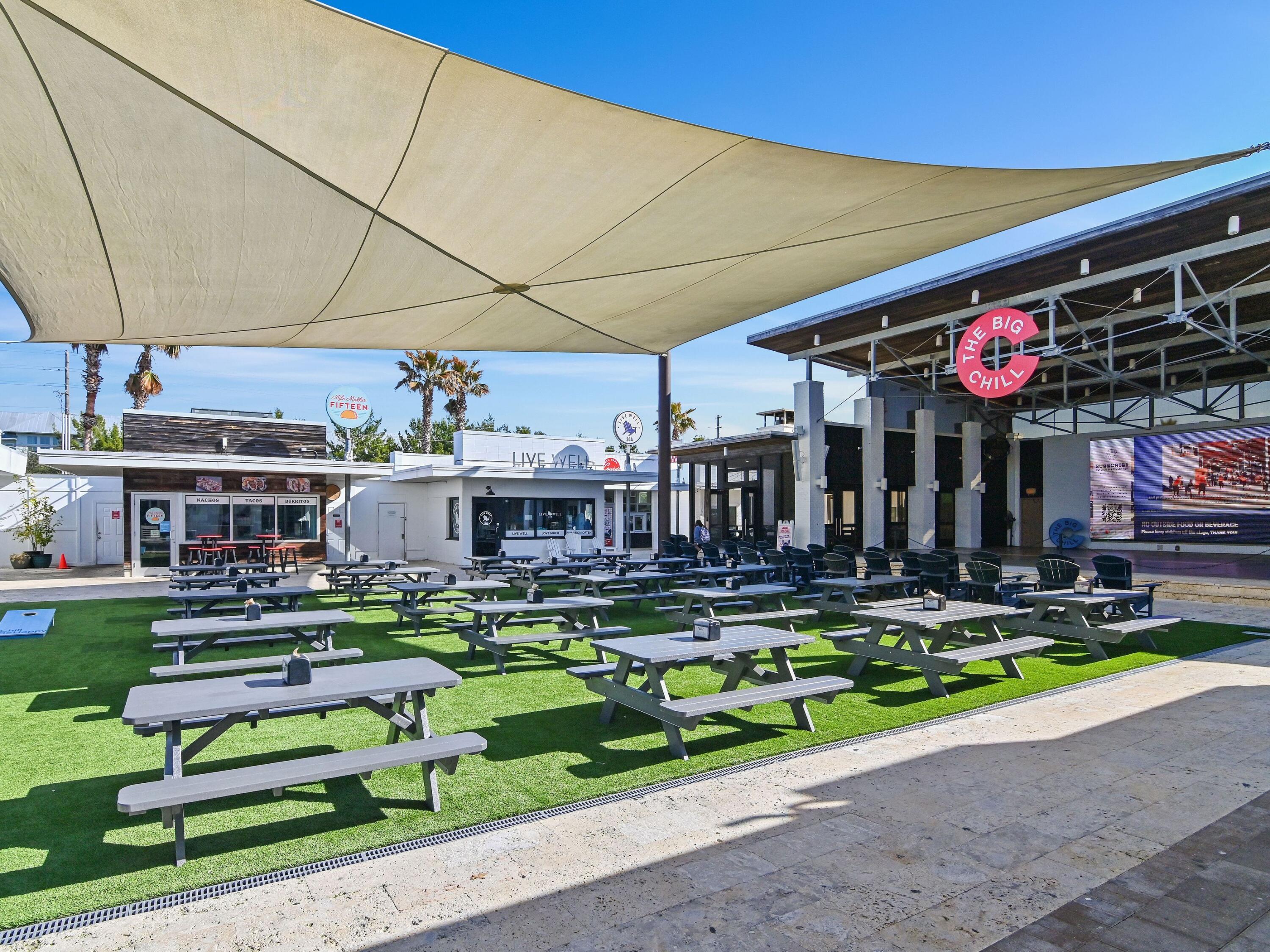 93 East Crabbing Hole Ln Inlet Beach Inlet Beach, FL 32461 - Photo 37 of 49 a view of a chairs and table in a patio