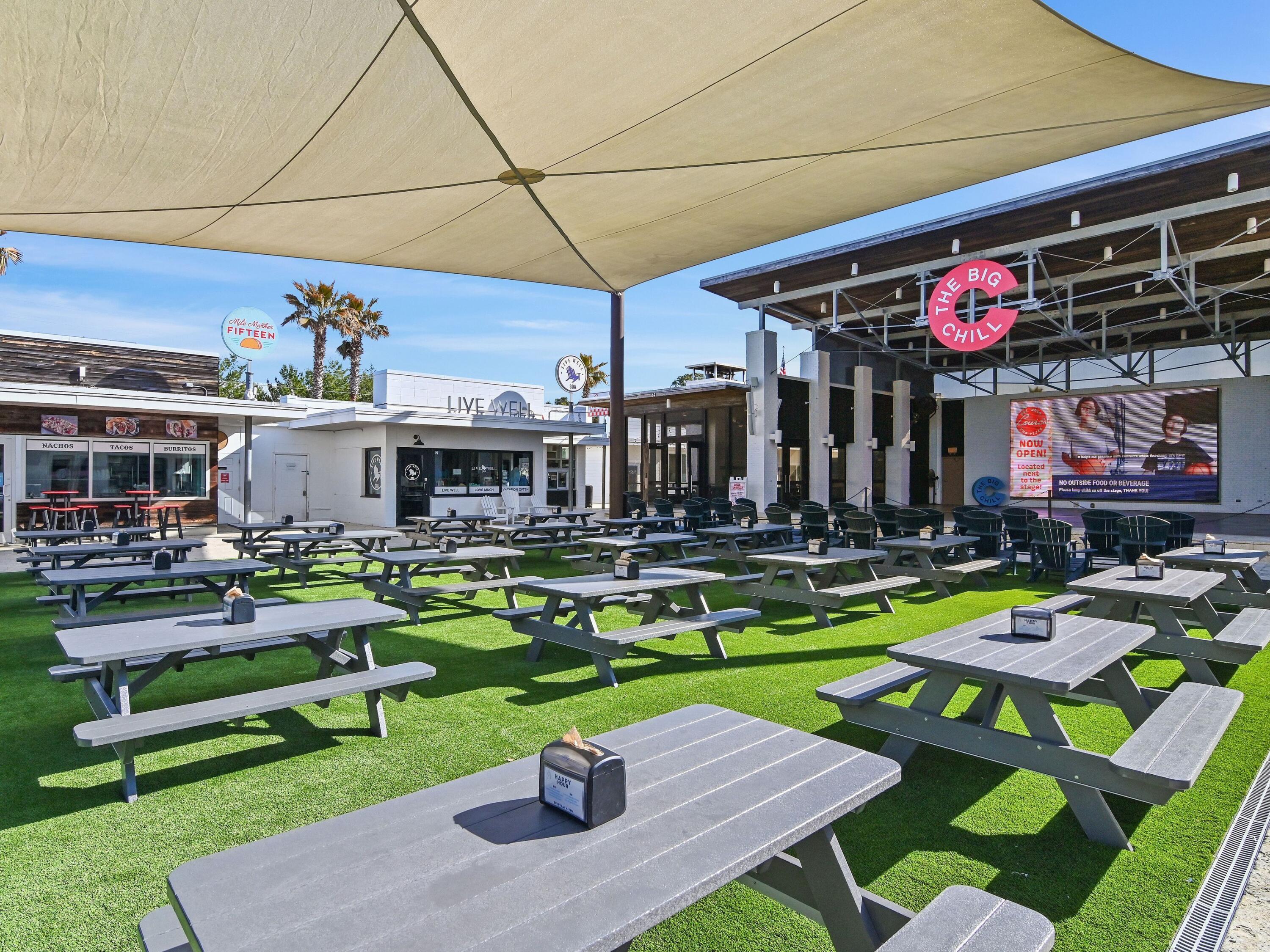 93 East Crabbing Hole Ln Inlet Beach Inlet Beach, FL 32461 - Photo 38 of 49 a view of a chairs and table in backyard of the house