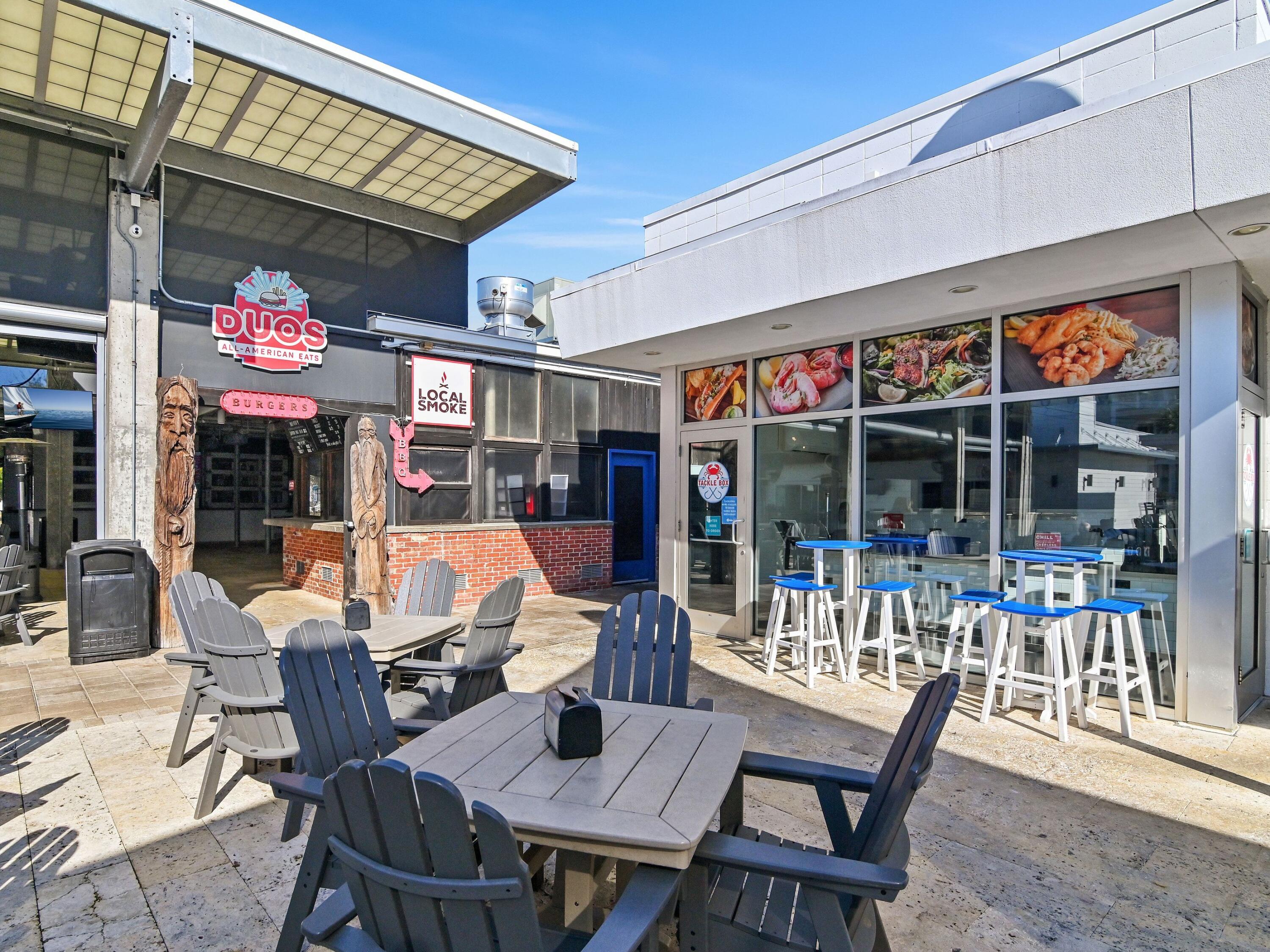 93 East Crabbing Hole Ln Inlet Beach Inlet Beach, FL 32461 - Photo 40 of 49 a view of a cafe with a dining table and chairs