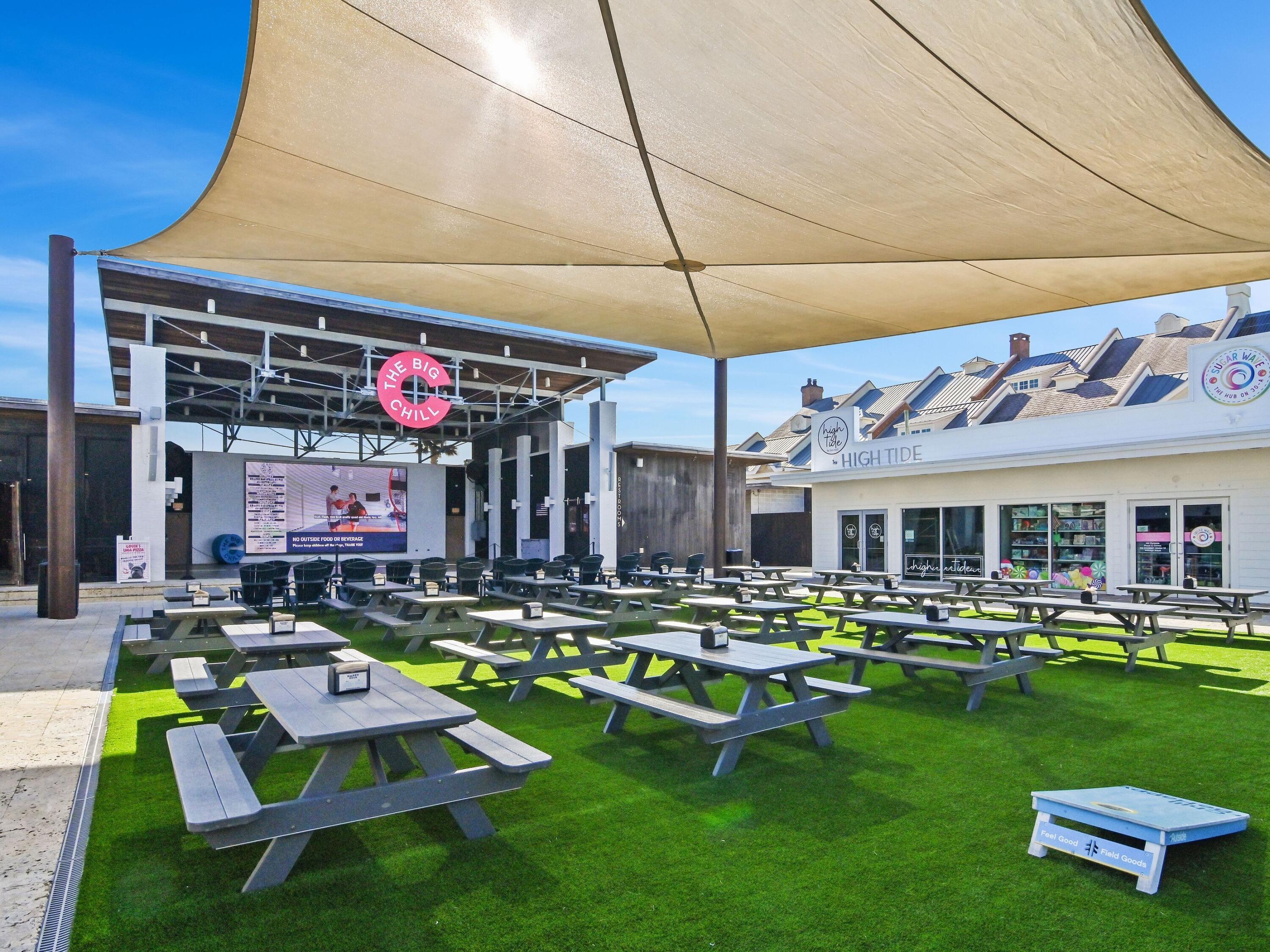 93 East Crabbing Hole Ln Inlet Beach Inlet Beach, FL 32461 - Photo 41 of 49 a view of a chairs and table in patio of a house