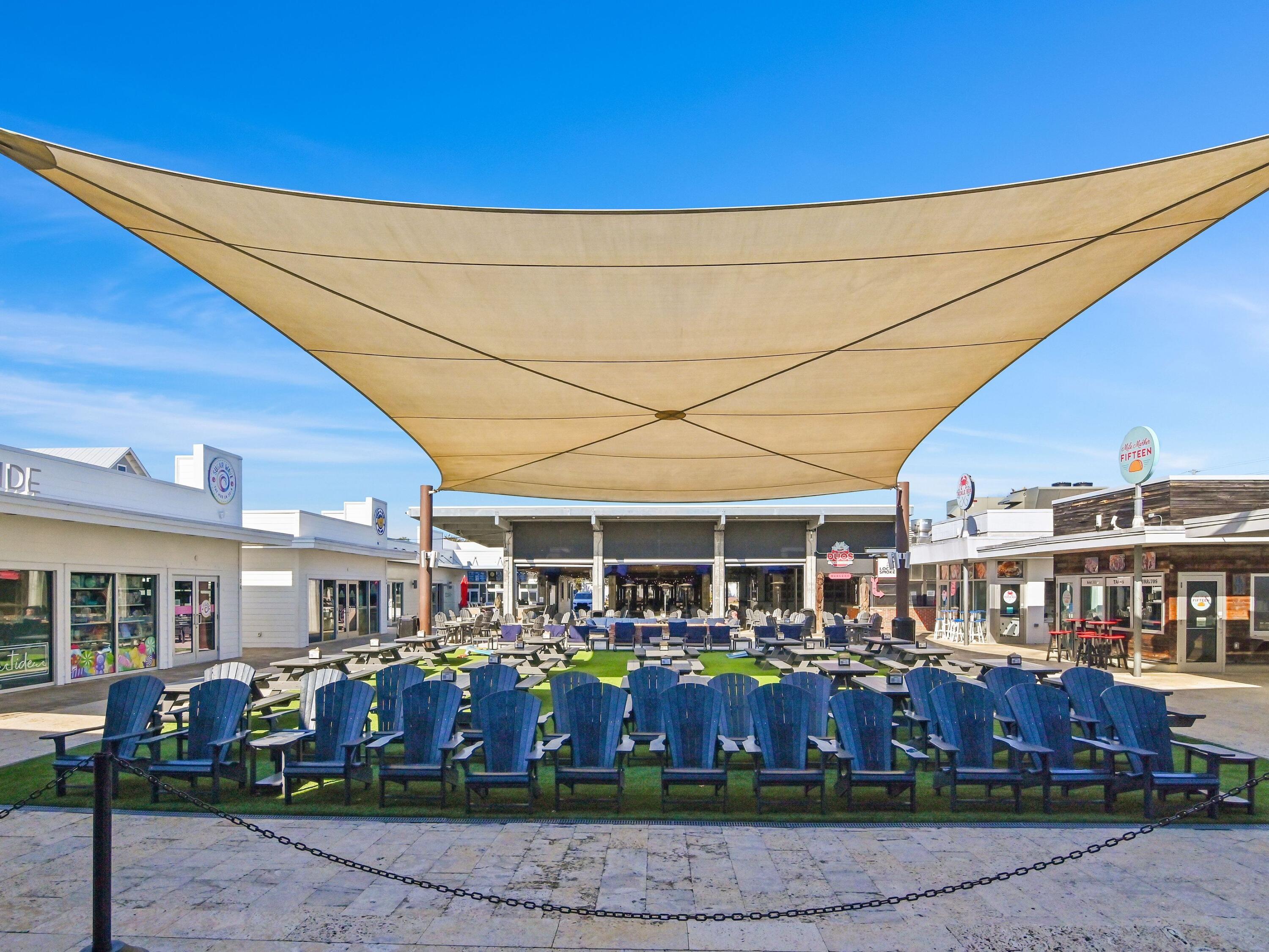 93 East Crabbing Hole Ln Inlet Beach Inlet Beach, FL 32461 - Photo 43 of 49 a view of a big room with many windows