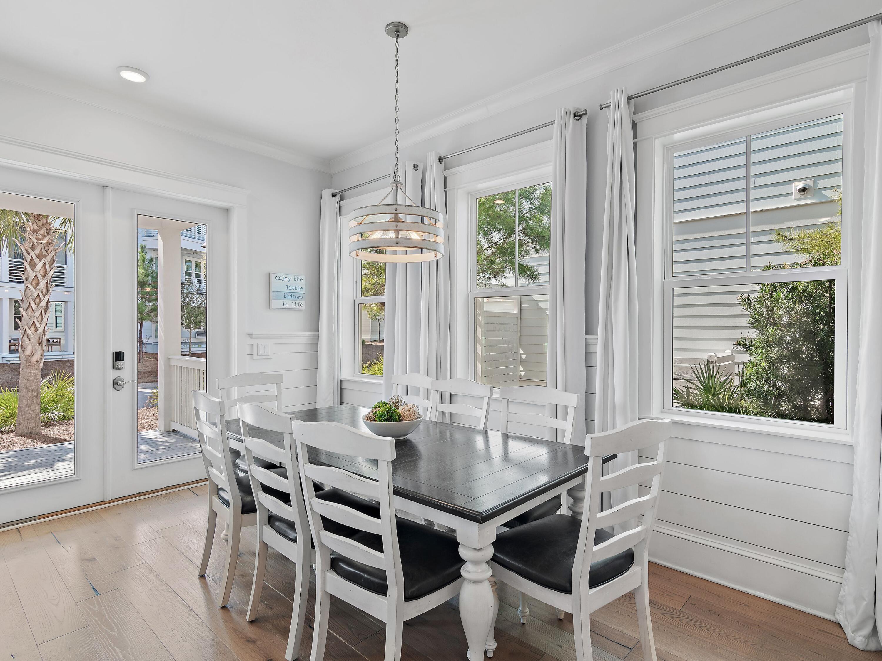 93 East Crabbing Hole Ln Inlet Beach Inlet Beach, FL 32461 - Photo 7 of 49 a view of a dining room with furniture and window