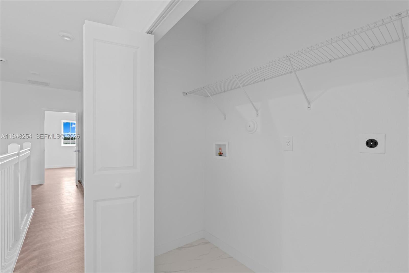 27335 Southwest 133rd Path Homestead, FL 33032 - Photo 19 of 39 a view of a hallway with wooden floor