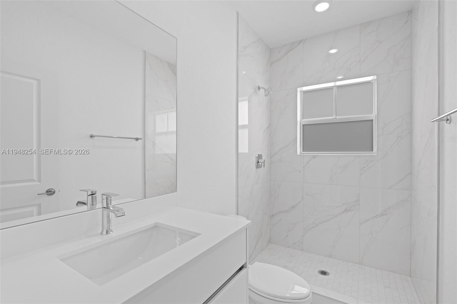 27335 Southwest 133rd Path Homestead, FL 33032 - Photo 22 of 39 a bathroom with a sink toilet and shower
