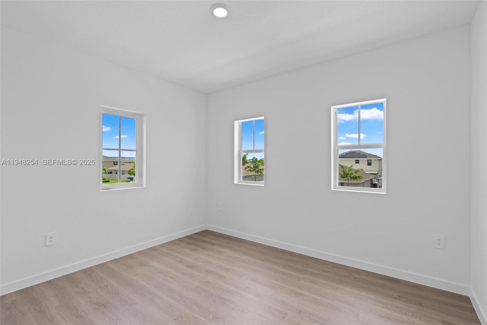 27335 Southwest 133rd Path Homestead, FL 33032 - Photo 24 of 39 an empty room with windows