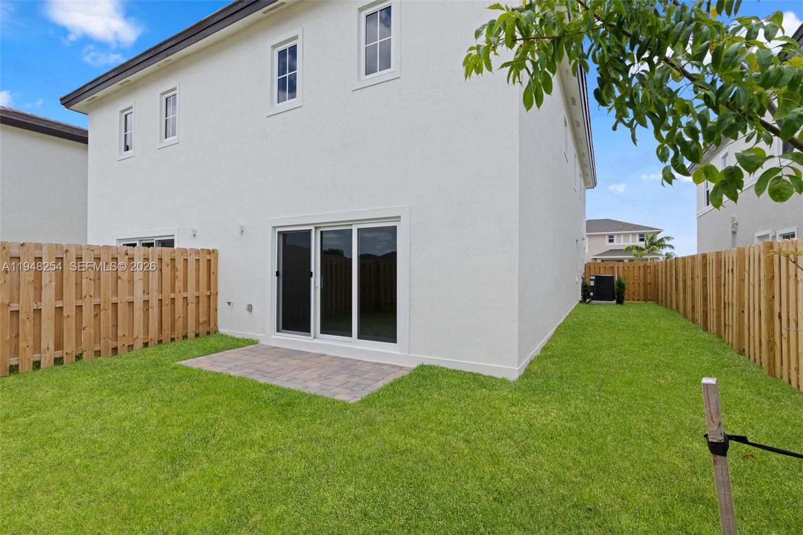 27335 Southwest 133rd Path Homestead, FL 33032 - Photo 38 of 39 a view of an house with backyard space and garden