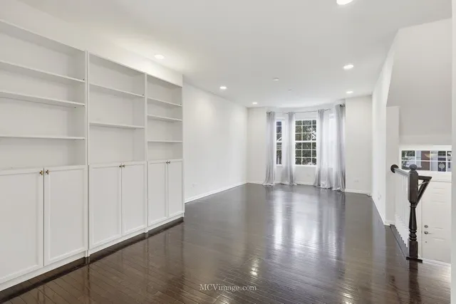 a view of a livingroom with wooden floor
