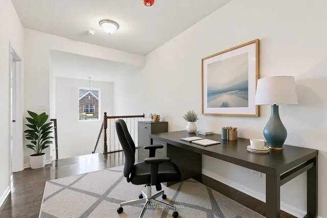 a view of a workspace with furniture