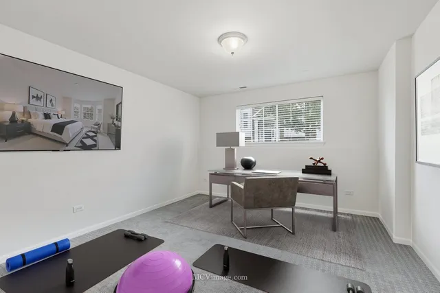 a workspace with furniture and window