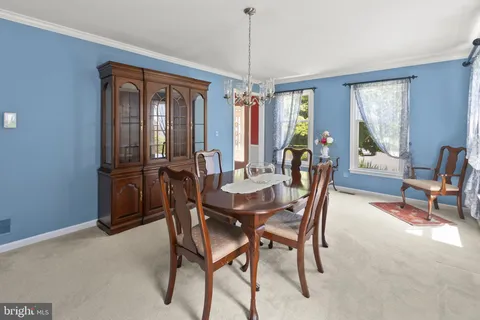 a view of kitchen with stainless steel appliances granite countertop a stove and a refrigerator