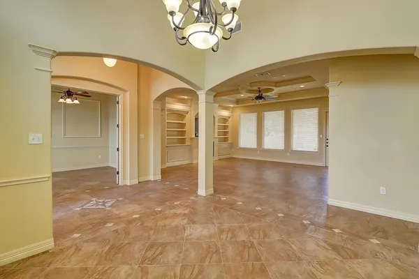 a view of a hallway with a chandelier