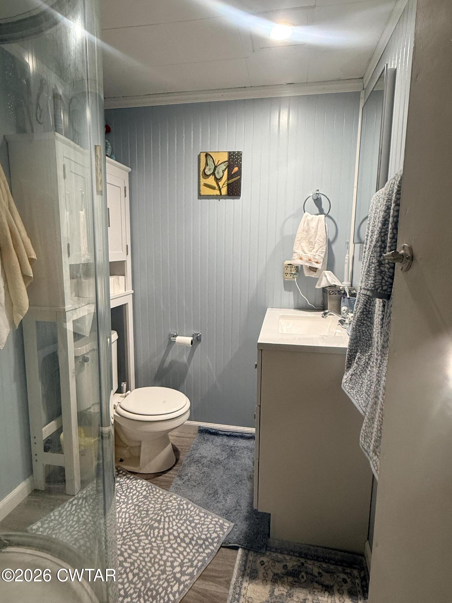 133 Maxine Nelson Road Parsons, TN 38363 - Photo 13 of 19 a bathroom with a toilet a sink and shower