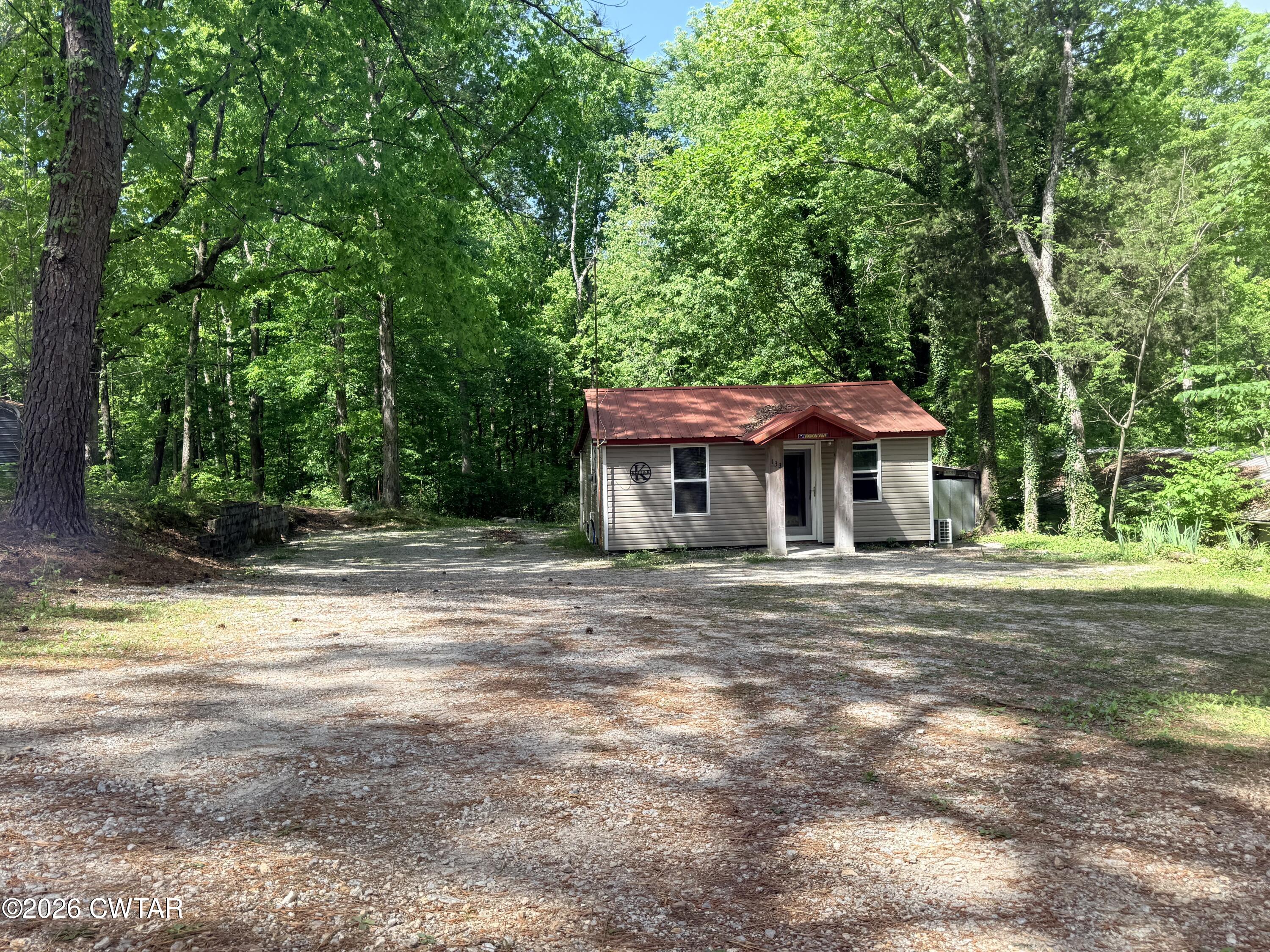 133 Maxine Nelson Road Parsons, TN 38363 - Photo 4 of 19 a front view of a house with a yard