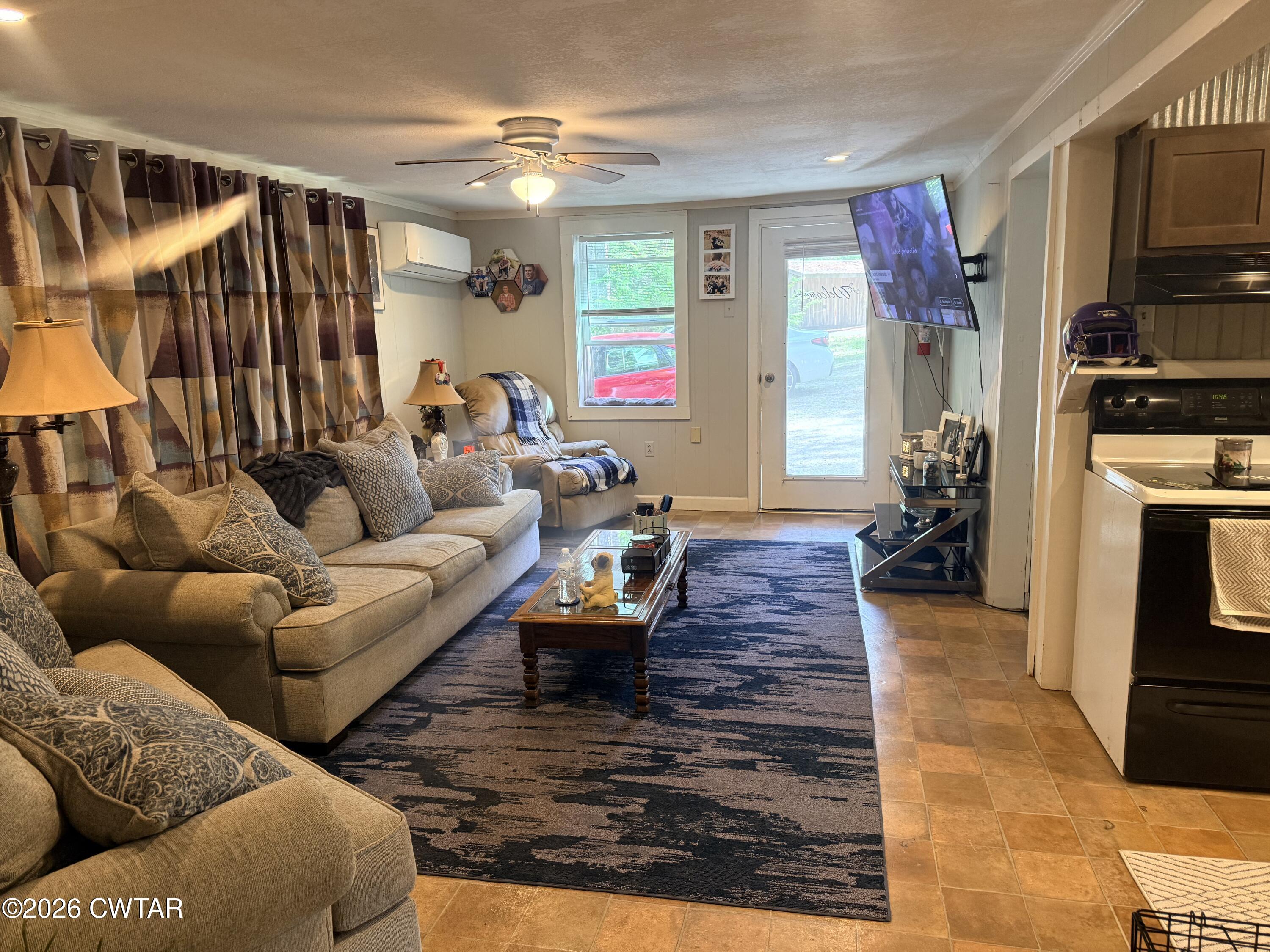 133 Maxine Nelson Road Parsons, TN 38363 - Photo 8 of 19 a living room with furniture and a flat screen tv