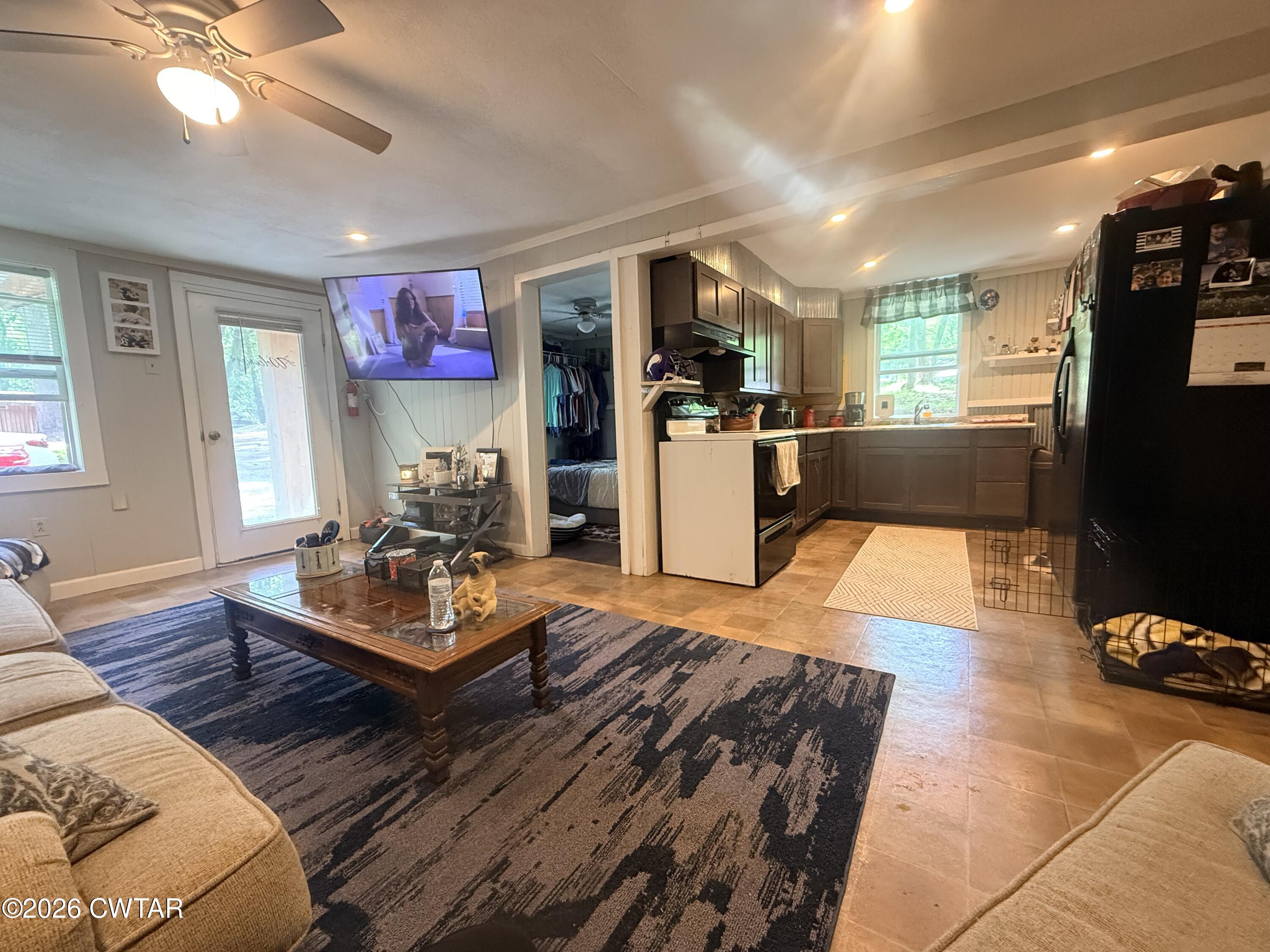 133 Maxine Nelson Road Parsons, TN 38363 - Photo 9 of 19 a living room with furniture and a flat screen tv