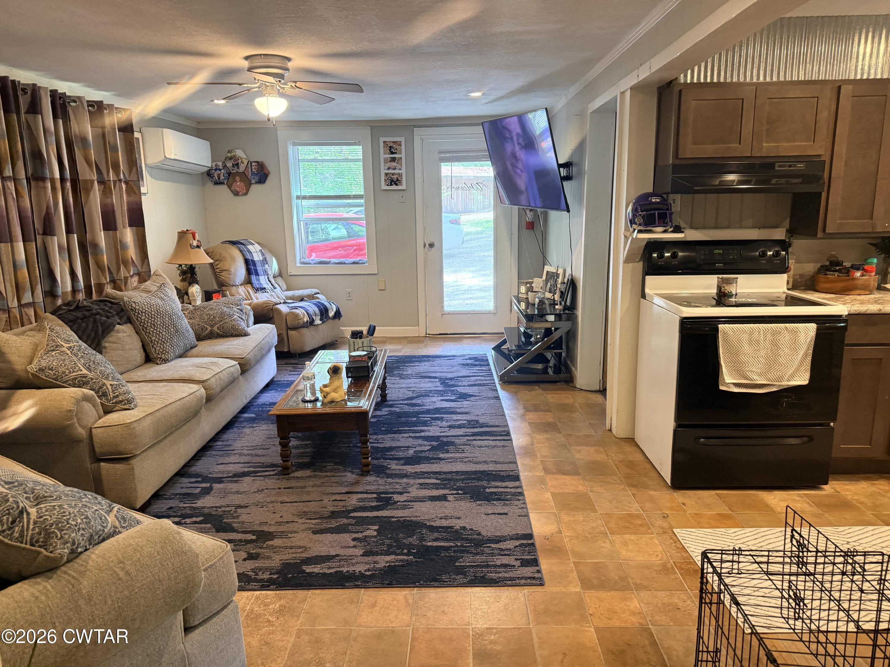 133 Maxine Nelson Road Parsons, TN 38363 - Photo 10 of 19 a living room with furniture and a flat screen tv