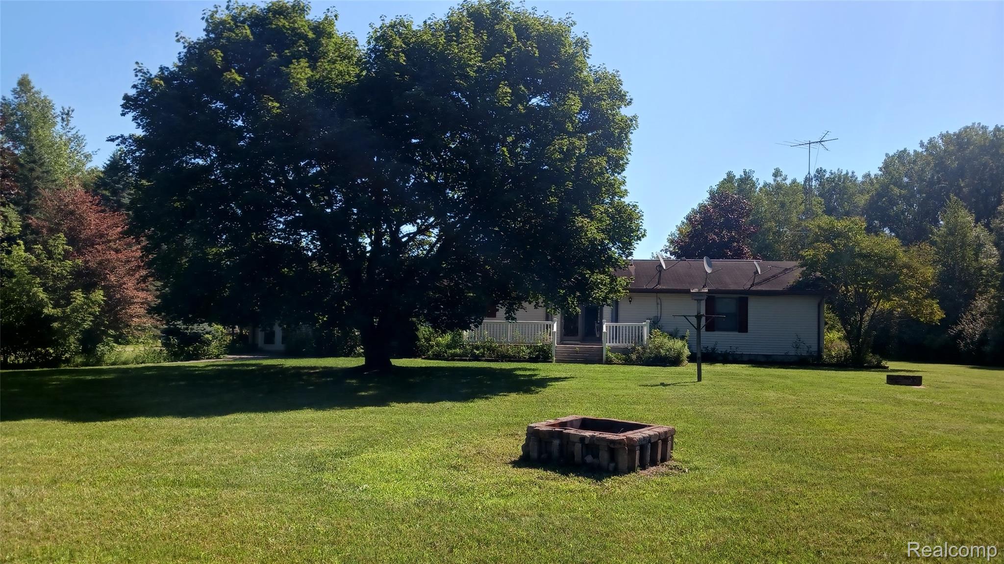 3803 Warner Road Cass City, MI 48726 - Photo 11 of 85 View of green lawn with a deck