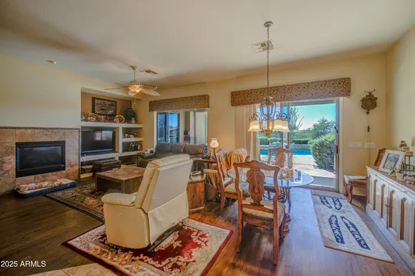 a living room with furniture fireplace and a flat screen tv