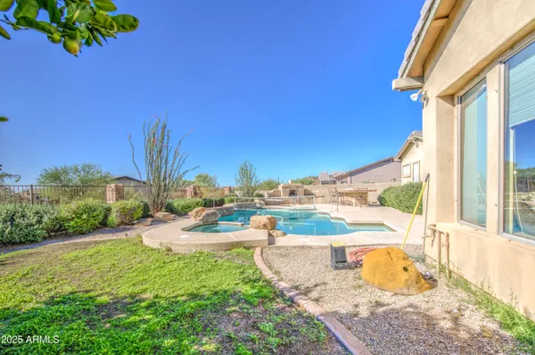 a view of a backyard with sitting area