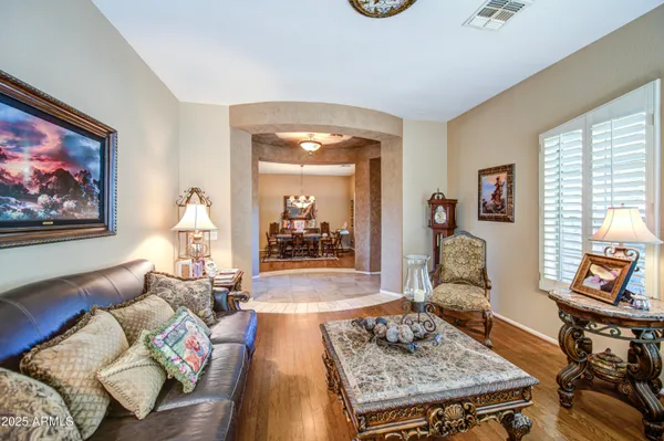 a living room with furniture and a table