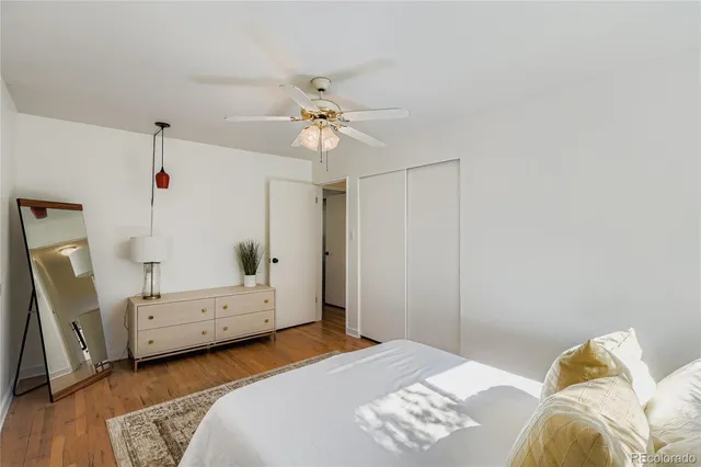 a bedroom with a bed and a chair