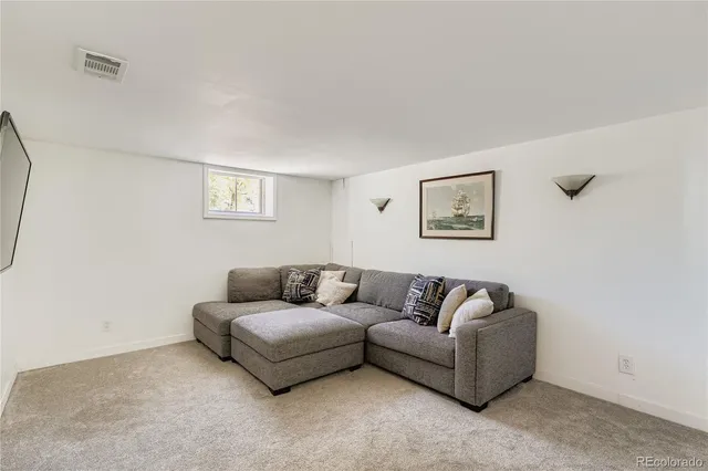 a living room with furniture and a couch