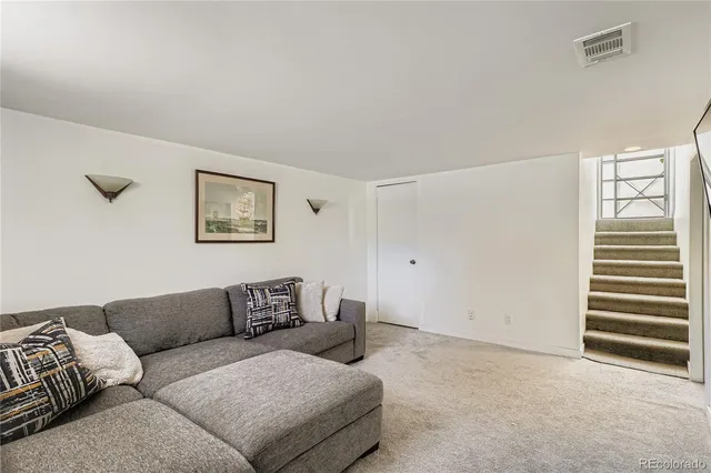 a living room with furniture and a couch