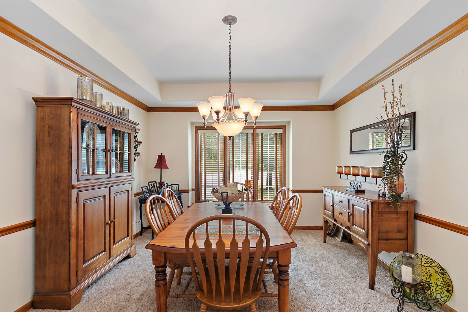 406 Catkins Way Cary, IL 60013 - Photo 14 of 32 a view of a a dining room with furniture window and wooden floor
