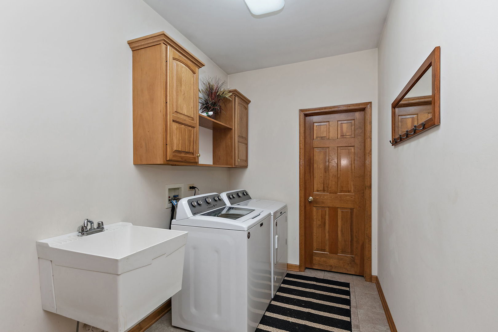 406 Catkins Way Cary, IL 60013 - Photo 17 of 32 a room with storage and utility