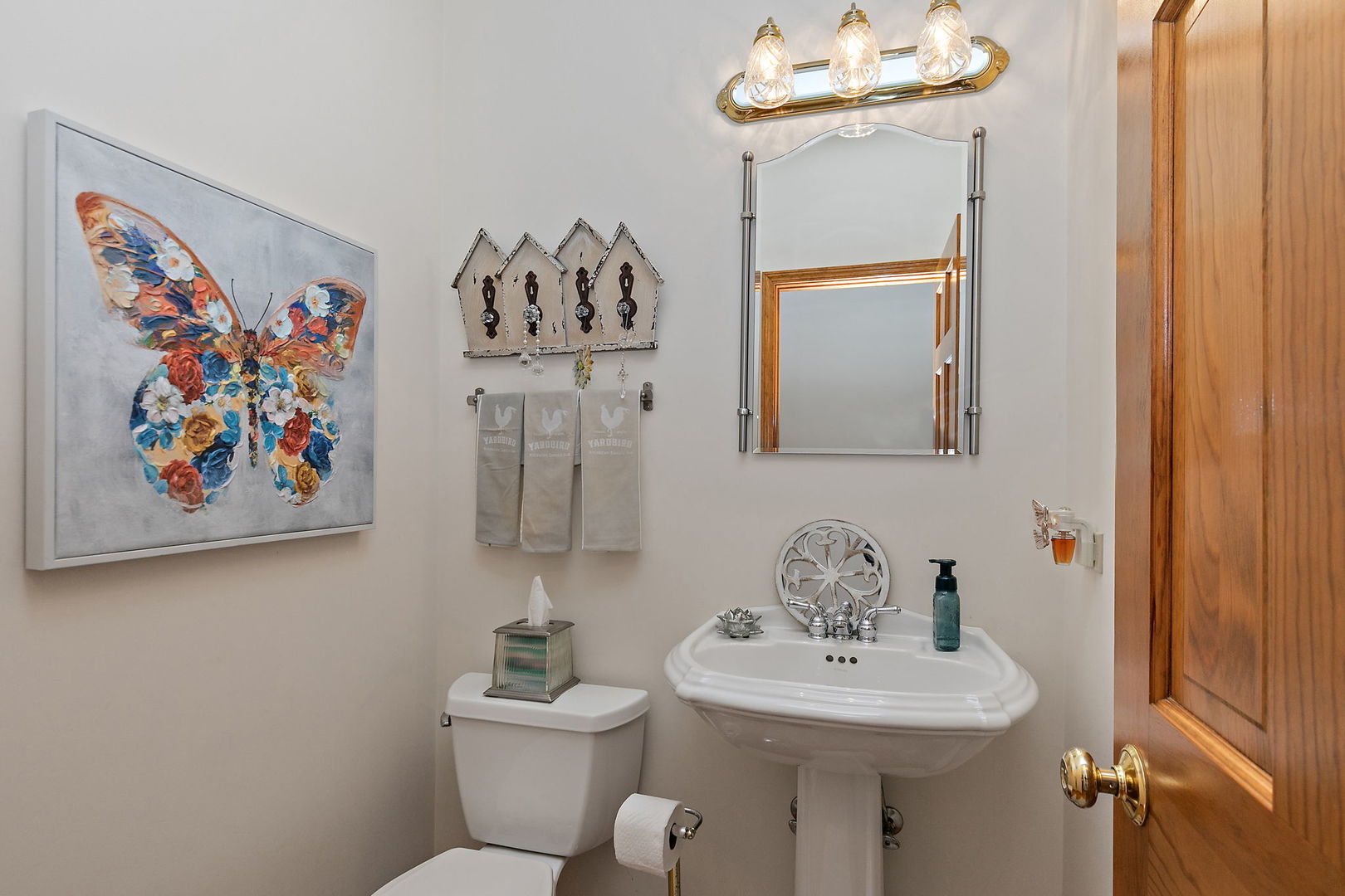 406 Catkins Way Cary, IL 60013 - Photo 18 of 32 a bathroom with a sink mirror and toilet