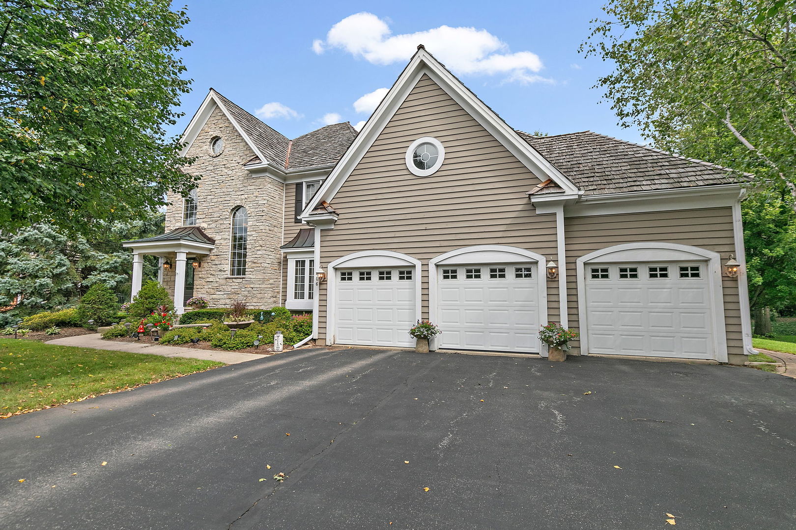 406 Catkins Way Cary, IL 60013 - Photo 2 of 32 a view of a house with a yard and garage