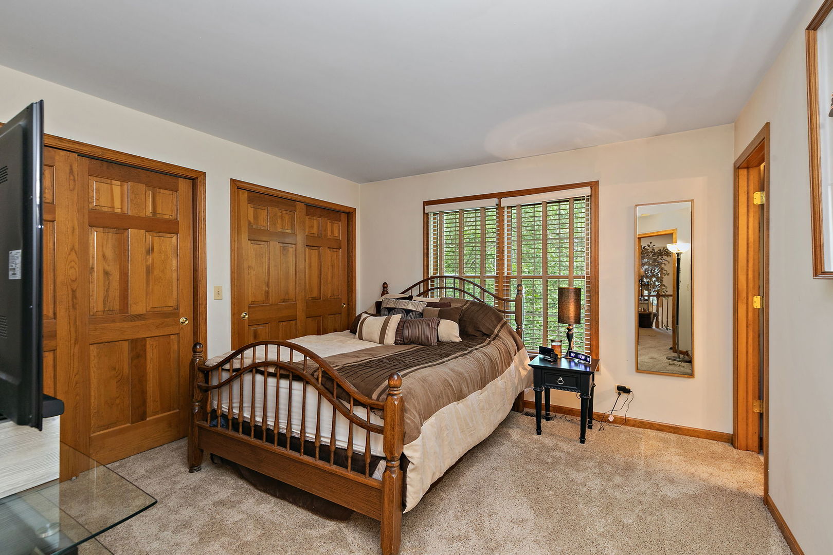 406 Catkins Way Cary, IL 60013 - Photo 24 of 32 a bed sitting in a bedroom next to a window