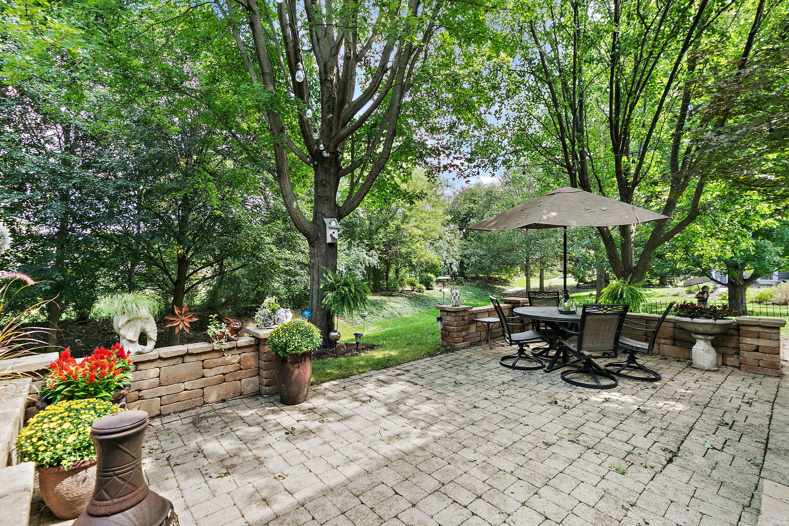 406 Catkins Way Cary, IL 60013 - Photo 30 of 32 a view of a backyard with sitting area and furniture