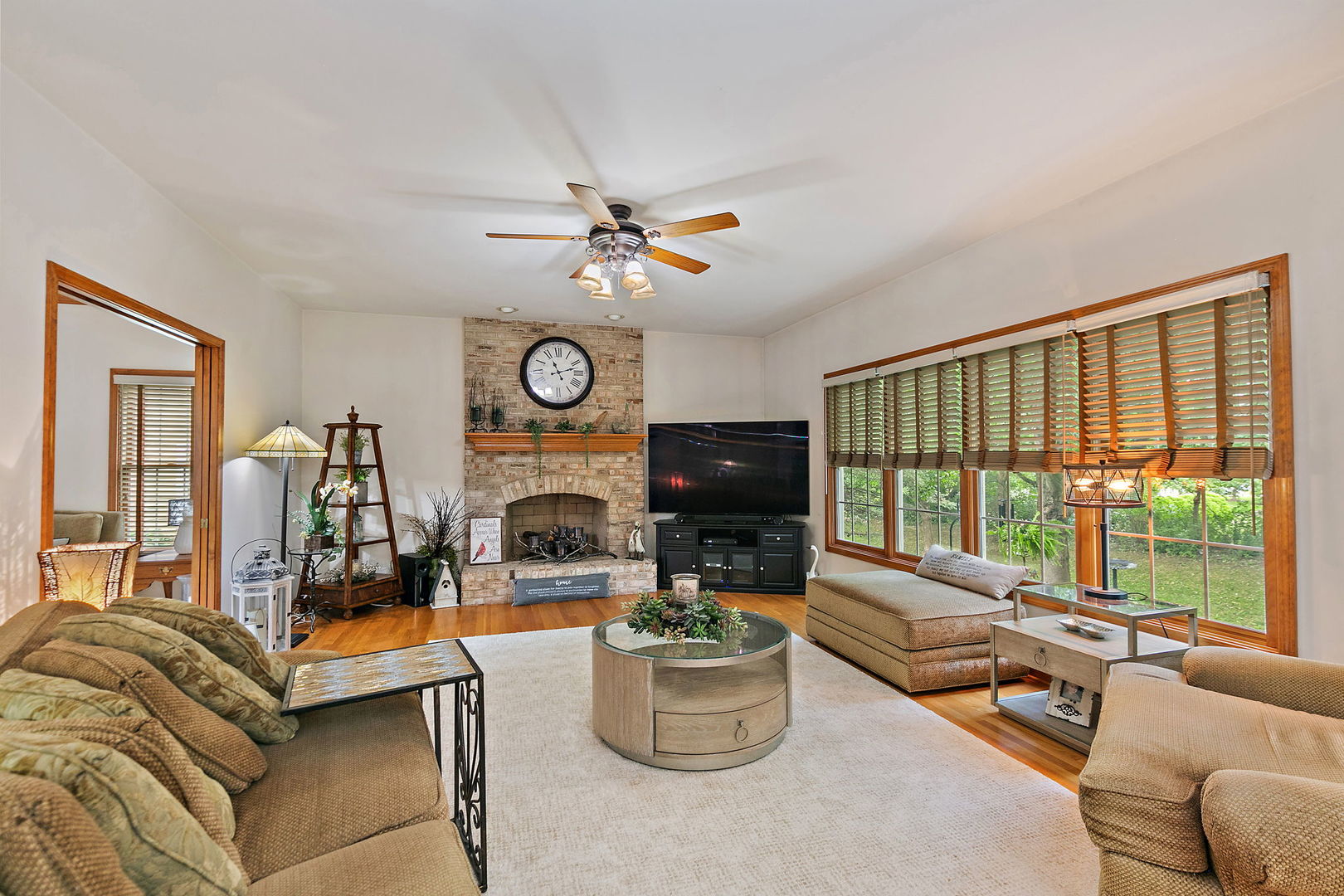 406 Catkins Way Cary, IL 60013 - Photo 8 of 32 a living room with furniture a fireplace and a window