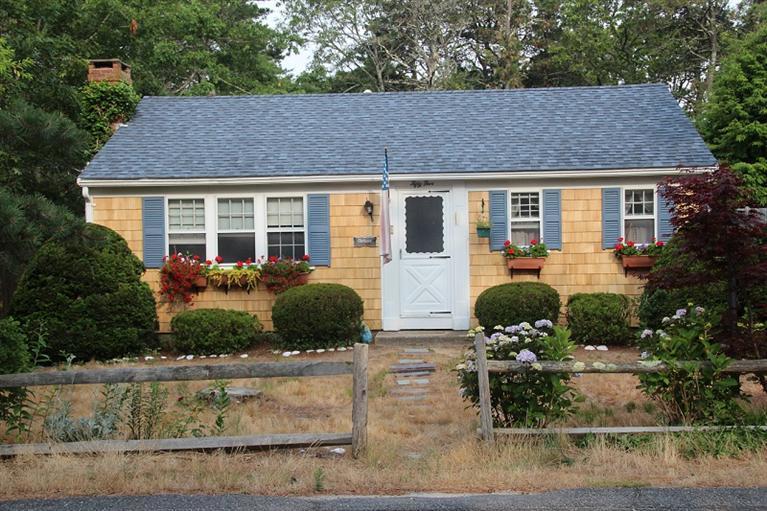 front view of a house with a yard
